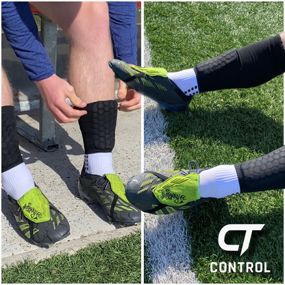 Person fixing their all in one control sports socks 